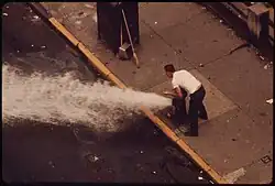 Image 19Litter is flushed from 172nd Street in Manhattan using hydrants (from History of New York City (1946–1977))
