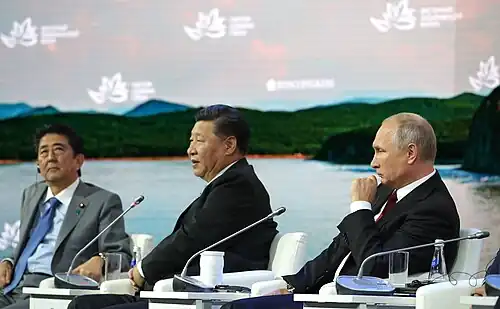 2018 Forum: (left to right) Prime Minister of Japan Shinzo Abe, Paramount leader of China Xi Jinping, and President of Russia Vladimir Putin