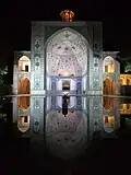 A view across the pool at night