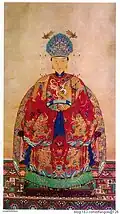 Wife of the 69th generation of Duke Yansheng, wearing mang ao and skirt
