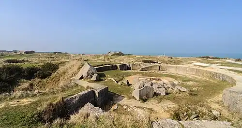 Part of the modern day site, with the remains of a gun pit in the foreground.