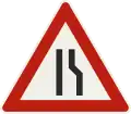 1.17b – Road narrows from the right (formerly used )