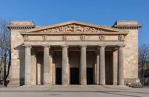 Greek Revival columns of the Neue Wache, Berlin, where the triglyphs were replaced by Nike figures, by Karl Friedrich Schinkel and Salomo Sachs, 1816[26]