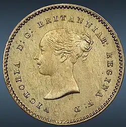 Copper coin with a woman's head facing left