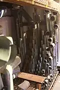 Casavant Frères ranks of round, grey metal organ pipes of all sizes inside one of the swell boxes inside the organ.