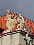 Architectural details of the palace, including a cornice sculpture of a monkey