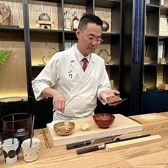 Chef makes hand roll