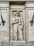 One of the reliefs featuring a labourer