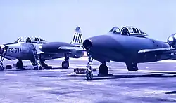 Republic F-84G-2-RE Thunderjet 51-9674 of the 492nd FBS, alongside a 492nd FBS F-84G in an experimental camouflage motif, 1954.