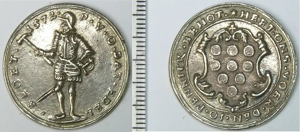 Two sides of a silver token