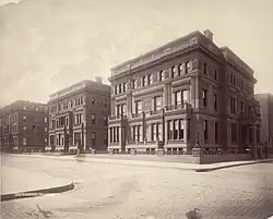 Three ornate three-story square mansions