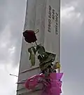 Floral tribute on a pillar