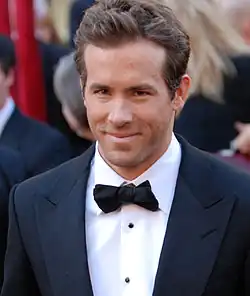 Reynolds looking at the camera with a small smile