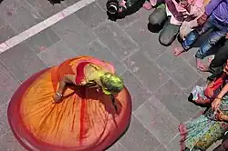 A play of colours then a dance at a Hindu temple near Mathura, at Holi