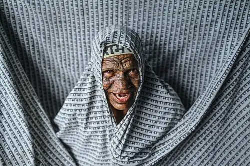 A member of the Ramnami Samaj, a movement among Dalits, whose members worship the Hindu deity Rama and tattoo their bodies with his name