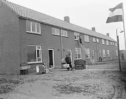 Inhabitants arrive in the new village (1957)