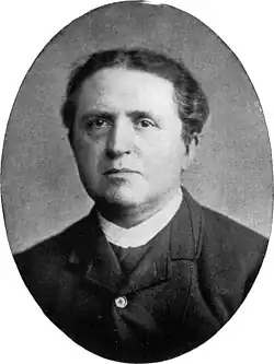 Black and white photo of a middle-aged Kuyper with short, dark hair.