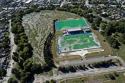Aerial view of Porritt Park after the February 2011 Christchurch earthquake, showing extensive soil liquefaction