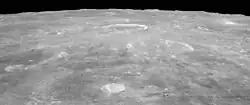 Oblique view facing south from Apollo 15, with Agrippa right of center, and the crater Godin above center showing bright rays.
