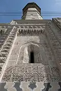 Detail of the mosque façade and minaret