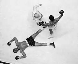 Ali standing over Williams