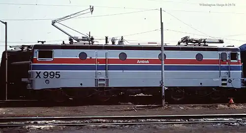 Silver locomotive with red and blue stripes