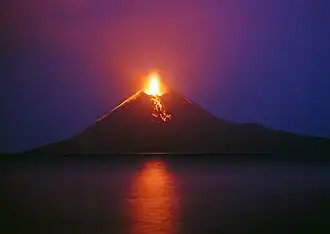 Aerial view of volcanic island with another, rocky island in the background