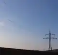 Strainer of a 110 kV-line with garland-like communication cable on the ground conductor