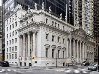 The courthouse as seen from the intersection of Madison Avenue and 25th Street. The facade is made of white marble. The main entrance pediment is on the right, along 25th Street. There are statues on the roof.