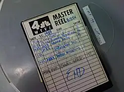 A videotape inside a cover with a cover sheet containing the WTVJ logo and various annotations