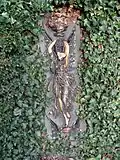 A glazed terracotta plaque approximately 40 metres (130&nbsp;ft) west of the fountain[8]