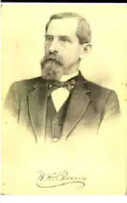 Portrait image of a Caucasian man in a suit
