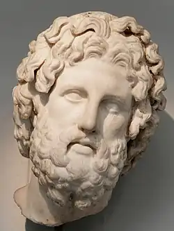 Room 22 – Colossal head of Asclepius wearing a metal crown (now lost), from a cult statue on Melos, Greece, 325–300 BC