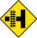(W7-12) Railway Level Crossing on Side Road (left)