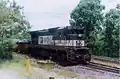 EFVM BB40-8M #1001 loading an 80 iron ore cars at Caue mine. Itabirá, MG – BR, in 2004.