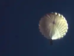 Beaver drop box parachuting to land Idaho 1950