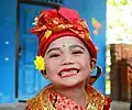 Child during a khitan (circumcision) ceremony