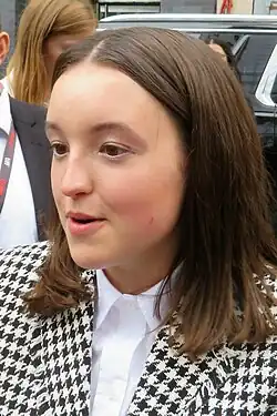 18-year-old girl talking to something to the left of the camera.