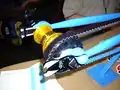 Horizontal fork ends and tugs for providing belt tension (without the wheel, for clarity)