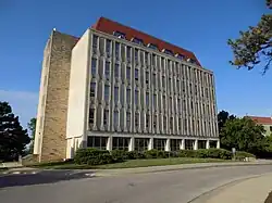 An art deco–style building against a clear blue sky