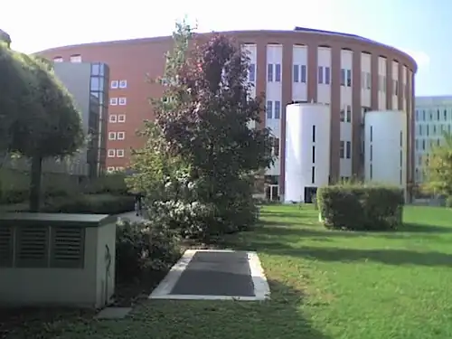 Full view on the ellipsoid Velodromo building, as seen from EGEA