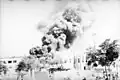 Oil tanks burning in Haifa as a result of bombing in October 1940.