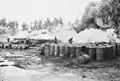 Firefighters work to extinguish a blaze at an oil installation after an Italian raid on Haifa in July 1940.
