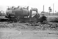 A burnt-out oil tanker truck after an Italian air raid on Haifa in July 1940.