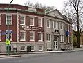 Historical campus building in Buffalo, NY with old Bryant & Stratton Business Institute sign.