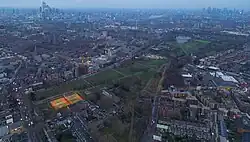 Burgess Park from above. January 2023. Visible tennis court, bmx race track, lake, football fields and other areas of Burgess Park.