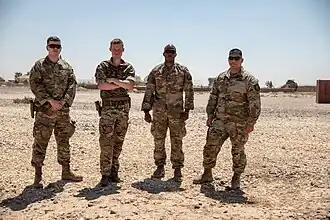 Combined Joint Task Force – Operation Inherent Resolve (CJTF–OIR) personnel pose for a picture during the Syrian intervention, 15 July 2021