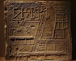 Pictorial brick depicting a typical Han-style palatial courtyard with watchtowers.