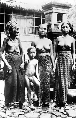 Three generations of women, all bare-brested, and a small boy nude in Bali, 1929