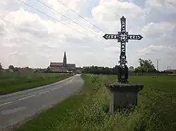 The cross and village in Cambronne-lès-Clermont